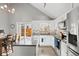 Modern kitchen with white cabinets, stainless steel appliances, and granite countertop at 12844 W Cross Dr, Littleton, CO 80127