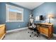 Bright home office with a desk, chair, and window at 12844 W Cross Dr, Littleton, CO 80127