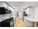 Bright kitchen featuring stainless steel appliances, and white cabinets at 5012 W 36Th Ave # 5, Denver, CO 80212