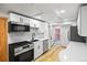 Bright kitchen with stainless steel appliances and white cabinets, with marble backsplashes at 5012 W 36Th Ave # 5, Denver, CO 80212