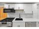 Modern kitchen featuring stainless steel appliances and a black sink at 5012 W 36Th Ave # 5, Denver, CO 80212
