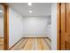 Open room with a white wall and wood flooring at 5012 W 36Th Ave # 5, Denver, CO 80212