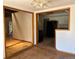 Open-concept dining area with views to the kitchen and living space at 5063 W Radcliff Ave, Denver, CO 80236