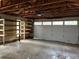 Attached two-car garage with ample shelving and storage at 5063 W Radcliff Ave, Denver, CO 80236