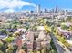 Enjoy the city view from this complex with a courtyard, trees, and city skyline at 1699 N Downing St # 302, Denver, CO 80218