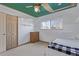 Bedroom view featuring a baseball-themed ceiling, a single bed, window, and shelving at 11237 W 59Th Ave, Arvada, CO 80004