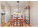 Elegant dining room with hardwood floors, display cabinet, and formal table at 11237 W 59Th Ave, Arvada, CO 80004