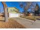 Charming two-story home with a well-maintained lawn and a two-car garage at 11237 W 59Th Ave, Arvada, CO 80004