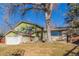 Charming two-story home with a well-maintained lawn and a two-car garage at 11237 W 59Th Ave, Arvada, CO 80004