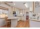 Cozy kitchen with ample counter space, wood floors, eat-in area, and natural light at 11237 W 59Th Ave, Arvada, CO 80004