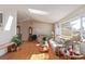 Inviting living room with hardwood floors, a skylight, and ample natural light at 11237 W 59Th Ave, Arvada, CO 80004