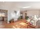 Inviting living room with hardwood floors, a skylight, and ample natural light at 11237 W 59Th Ave, Arvada, CO 80004