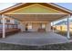 A covered patio includes a seating bench, a brick wall and sliding glass door at 11237 W 59Th Ave, Arvada, CO 80004