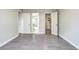 Open bedroom featuring tile flooring, an open closet, and bathroom access at 600 Manhattan Dr # 4C, Boulder, CO 80303