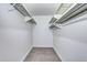 Walk-in closet with shelves and hanging rods, ready for organization at 600 Manhattan Dr # 4C, Boulder, CO 80303