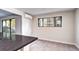 Bright kitchen with a sliding glass door to a balcony and a window at 600 Manhattan Dr # 4C, Boulder, CO 80303