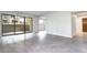 Open living room with sliding glass doors leading to balcony, and tile flooring throughout at 600 Manhattan Dr # 4C, Boulder, CO 80303