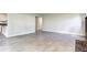 Living room featuring tile flooring, and entryways to other rooms at 600 Manhattan Dr # 4C, Boulder, CO 80303