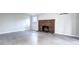 Open living room featuring a brick fireplace and sleek tile flooring at 600 Manhattan Dr # 4C, Boulder, CO 80303