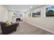 Finished basement with a cozy fireplace and comfortable seating area, perfect for relaxation at 8334 Allison Ct, Arvada, CO 80005