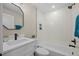 Modern bathroom features a sleek vanity, tub, and tiled shower with a modern shower head at 8334 Allison Ct, Arvada, CO 80005