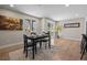 Bright dining area with a modern table set next to sliding door to outdoor area at 8334 Allison Ct, Arvada, CO 80005