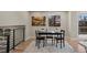 Cozy dining area with a modern black table set and natural light from the window at 8334 Allison Ct, Arvada, CO 80005