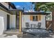 Inviting front porch with seating, enhancing curb appeal and creating a welcoming entrance at 8334 Allison Ct, Arvada, CO 80005