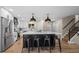 Modern kitchen with a large center island, stainless steel appliances, and stylish pendant lighting at 8334 Allison Ct, Arvada, CO 80005
