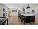 Open-concept kitchen with a large island, stainless steel appliances, and plenty of counter space at 8334 Allison Ct, Arvada, CO 80005