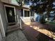 Gray house with a black front door and small patio at 3611 S Ouray Cir, Aurora, CO 80013