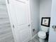 The toilet features an art piece above the tank at 12223 E Ford E Ave # 12223, Aurora, CO 80012