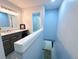 Bathroom features a modern vanity with granite countertops and stylish fixtures at 12223 E Ford E Ave # 12223, Aurora, CO 80012