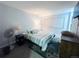 This bedroom has a window, a rug, and a fan at 12223 E Ford E Ave # 12223, Aurora, CO 80012