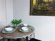 Casual dining area with table and chairs and light from the window at 12223 E Ford E Ave # 12223, Aurora, CO 80012