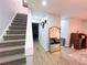 Home entryway with stairs and decor on the walls, and wood floors at 12223 E Ford E Ave # 12223, Aurora, CO 80012