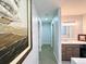 Hallway to the bathroom and bedrooms with decorative art on the walls at 12223 E Ford E Ave # 12223, Aurora, CO 80012