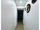 Long hallway features neutral walls, modern decor and wood-look floors at 12223 E Ford E Ave # 12223, Aurora, CO 80012
