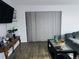 Living room with wood floors, decor, and a gray sectional sofa at 12223 E Ford E Ave # 12223, Aurora, CO 80012