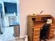 Living area showing vintage desk and kitchen view for comfortable living at 12223 E Ford E Ave # 12223, Aurora, CO 80012
