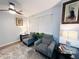 The living room area features warm natural light and comfortable seating at 12223 E Ford E Ave # 12223, Aurora, CO 80012