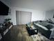 Comfortable living room featuring a sofa, coffee table, side table and decor at 12223 E Ford E Ave # 12223, Aurora, CO 80012