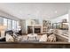 Spacious living room featuring a fireplace and built-in shelving at 14409 W Yale Pl, Lakewood, CO 80228