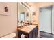 Bathroom with a vanity, mirror, and artwork displayed on the walls at 2541 S Bahama Cir # F, Aurora, CO 80013