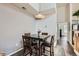 Cozy dining area with a wooden table, chairs, and a view into the kitchen at 2541 S Bahama Cir # F, Aurora, CO 80013