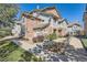 Charming multi-story home features stone accents, manicured landscaping, and inviting walkways at 2541 S Bahama Cir # F, Aurora, CO 80013
