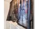 Functional laundry area with washer and dryer, shelving unit behind a curtain at 2541 S Bahama Cir # F, Aurora, CO 80013