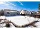 Spacious backyard covered in snow, ideal for outdoor recreation at 3564 S Jebel Cir, Aurora, CO 80013