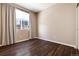 Simple bedroom with dark hardwood floors and window coverings at 3564 S Jebel Cir, Aurora, CO 80013