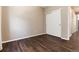 Bedroom with dark hardwood floors and double door closet at 3564 S Jebel Cir, Aurora, CO 80013